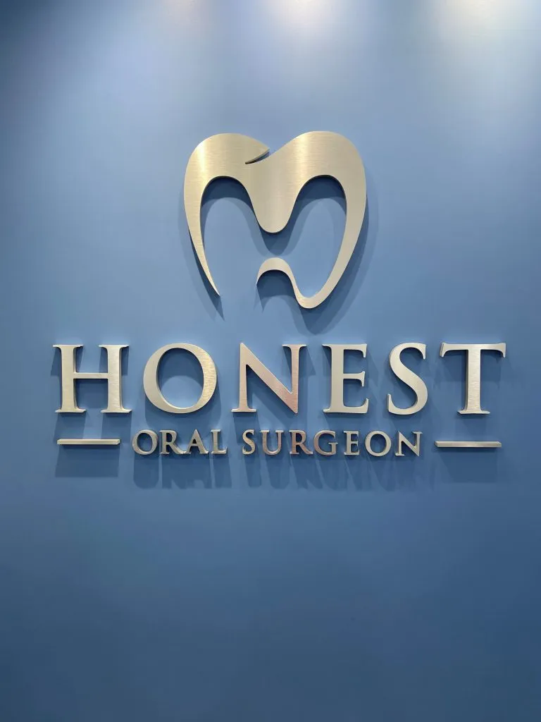 Office wall with Dr's logo of tooth and the word Honest